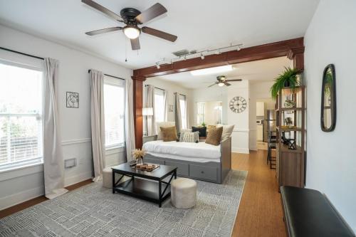 a living room with a couch and a ceiling fan at Updated 1 BR Home - Steps to 7th Ave in Tampa