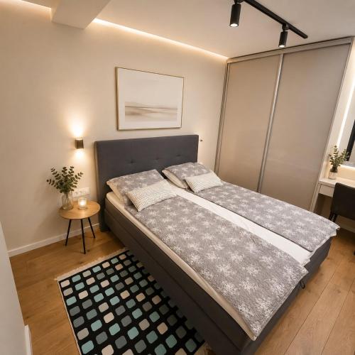 a bedroom with a bed in a room at Vi Lux Apartments in Visoko
