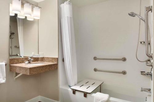 a bathroom with a sink and a shower at Extended Stay America Suites - Denver - Broomfield in Broomfield