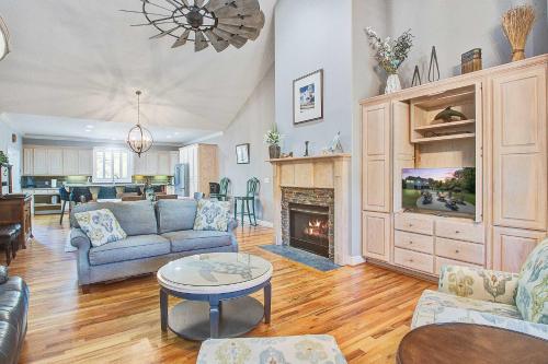 a living room with a couch and a fireplace at Why Knot? in Edisto Island