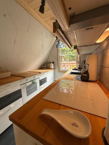 a kitchen with a sink on a wooden counter at Kamień na Kaszubach in Kamień