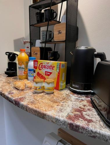 a counter top with some food on top of it at Maison Stanislas Spa Suites in Nancy