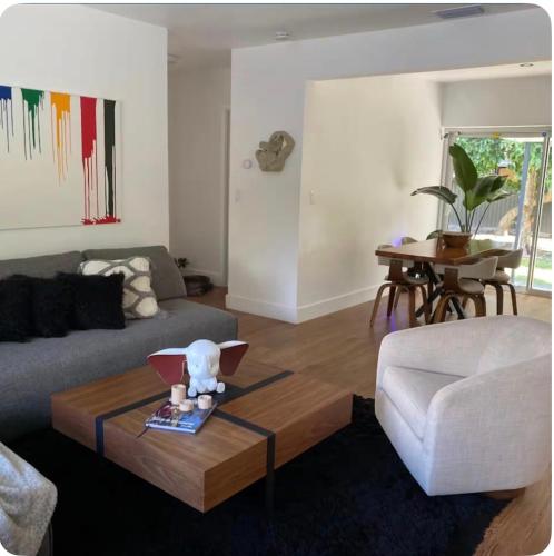 a living room with a couch and a coffee table at Casa paz in North Miami Beach