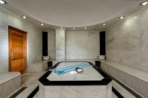 a room with a bed in the middle of it at Crowne Plaza Antalya by IHG in Antalya