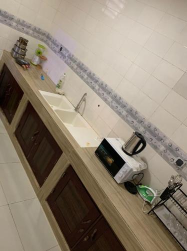 a kitchen counter with a sink and a toaster at Villa de 2 chambres in Porto-Novo
