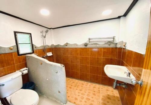 a bathroom with a toilet and a sink at Villa Beside Swiming Pool With Garden View in Ban Map Khangkhao