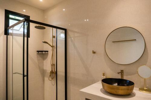 a bathroom with a wooden bowl sink and a shower at Luxury Villa with Private Pool, Srithanu in Ko Kong Nui