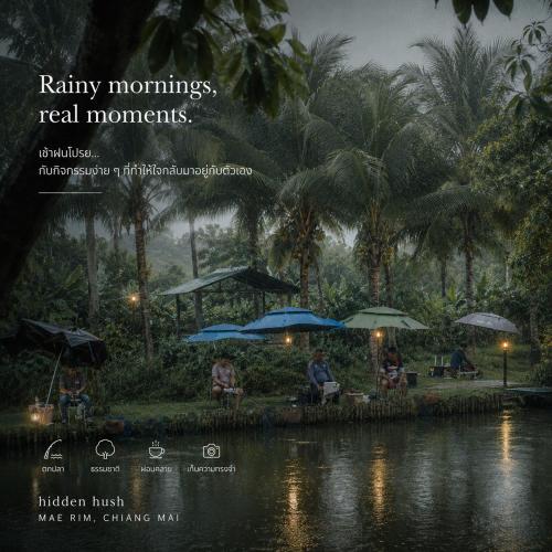 a picture of people sitting under umbrellas in the rain at Hidden hush hideaway in Ban Mo