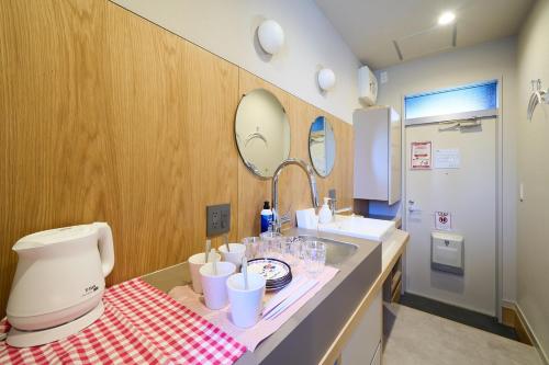 a bathroom with a counter with a mixer and a sink at Inside Sangreen - Vacation STAY 22712 in Tokyo