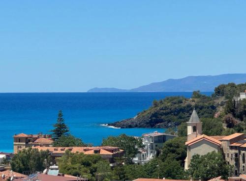 a view of a town and the ocean at Marina Panoramic Sea View in Scalea