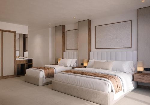 a bedroom with two beds and a table with lights at Kaani Haven Beach in Ukulhas