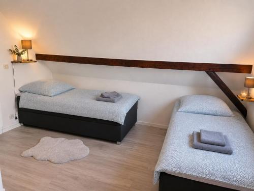 a room with two beds and two pillows at Ferienhaus Sonnendeck in Simmerath