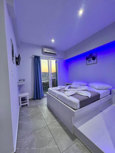 a purple bedroom with a large bed in a room at Princess Sissy in Ios Chora