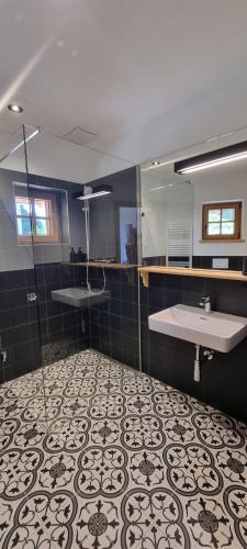a bathroom with a sink and a mirror at Bergmichlhof in Ragnitz