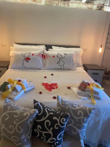 a bed with two hello kitty pillows on it at La casetta di Giogi in Sutri