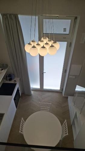 a white table in a kitchen with a large window at Brizo in Termoli