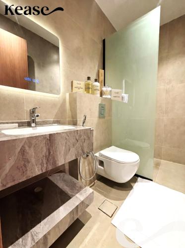a bathroom with a sink and a toilet at Kease Hittin S-18 Latest Development ZA44 in Riyadh