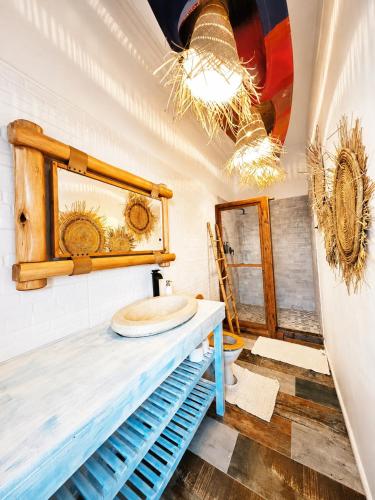 a bathroom with a sink on top of a counter at SeaViu Camps Bay in Cape Town