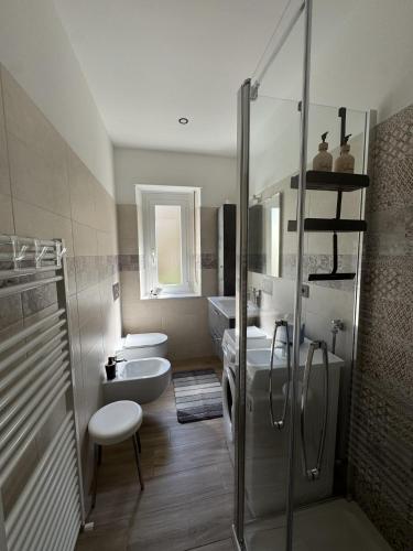 a bathroom with a shower and a toilet and a sink at Casa dolce Casa in Rapallo