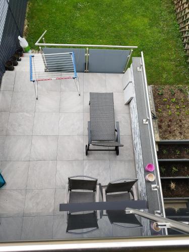 an overhead view of a patio with a table and chairs at Dreiländereck erkunden in Lörrach