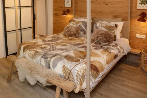 a bedroom with a bed with a four poster bed at Ons Hofke in Lubbeek