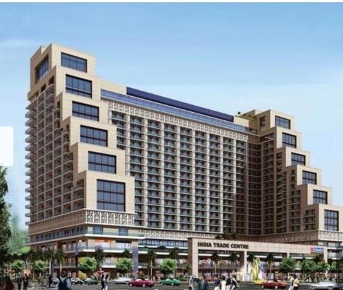 a large building with people walking in front of it at TOM n JERY STAYS in Greater Noida