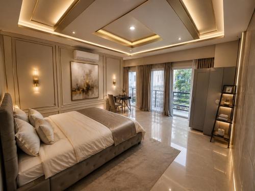 a bedroom with a large bed and a table at 52stone scent poolvilla - A in Angeles