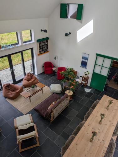 a large living room with couches and a table at Lon Godrum in Kingsburgh