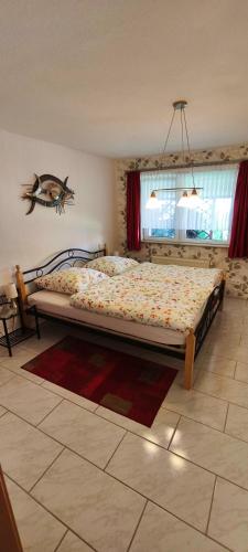 a bedroom with a large bed in a room at Ferienhaus Margarete in Dankerode