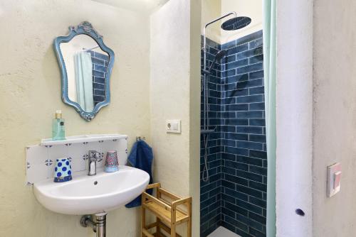 a bathroom with a sink and a mirror at Mas Ferrer Petit by 123ole in Sant Andreu del Terri