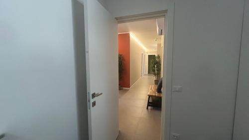 an open door to a room with a hallway at Panda House - Padova Station in Padova