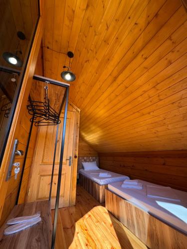 an inside of a sauna with wooden walls and ceilings at Seaside Cottages, BEDO HOUSE in Batumi