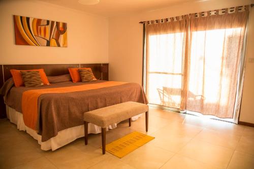 Una cama o camas en una habitación de Colinas de Nono