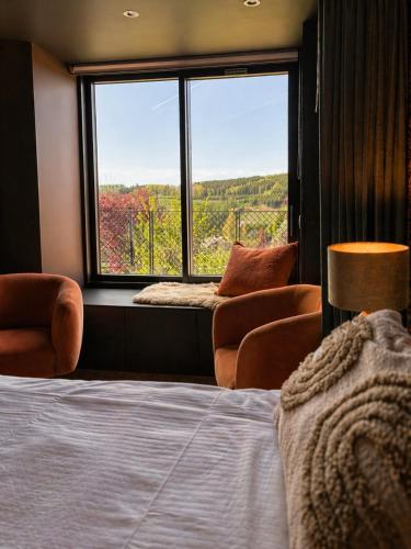 En eller flere senger på et rom på B&B La Bouliniere