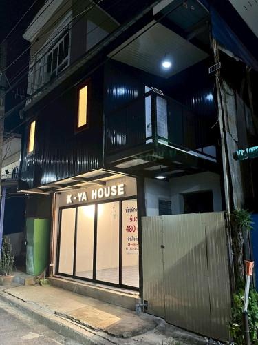 a building with a kya house with a balcony at K-YA house in Phitsanulok