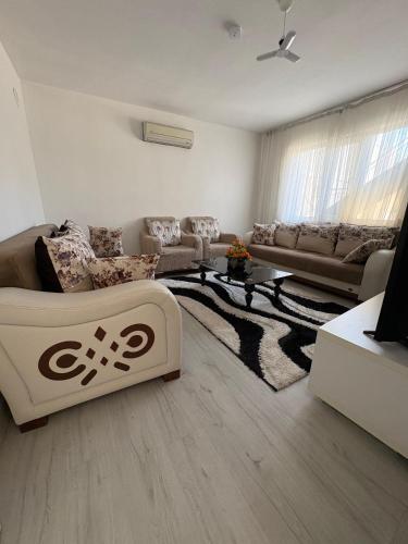 a living room with a couch and a table at HAPPY HOUSE 2 Pamukkale in Pamukkale