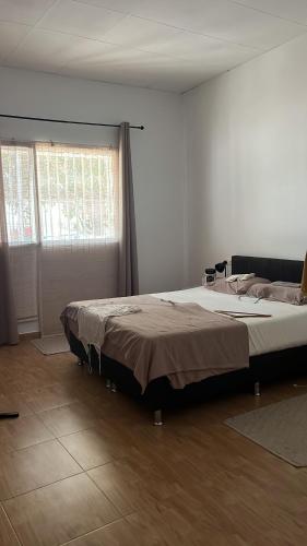 a bedroom with a large bed in a room at Ca Zoe calma y mar in Matola
