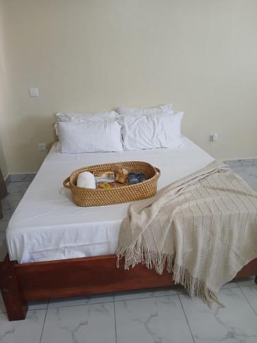 a basket of eggs sitting on a bed at Mbeyustays in Malindi