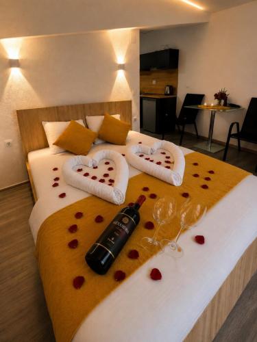 a bedroom with a bed with two valentines hearts at Apartments Sunset Jovanoski in Ohrid