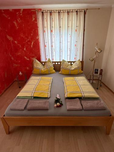 a bedroom with two beds and a window at Haus Brenntara 1 in Rangersdorf