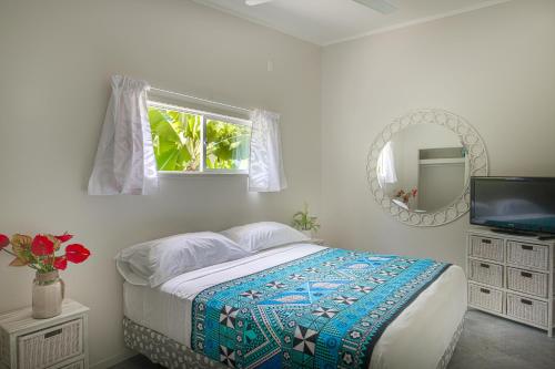 Ένα ή περισσότερα κρεβάτια σε δωμάτιο στο Mama Taras Bungalows