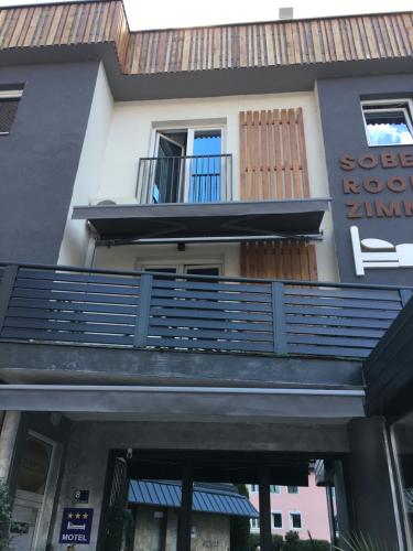 a building with a balcony in front of it at Motel Liberta in Jajce