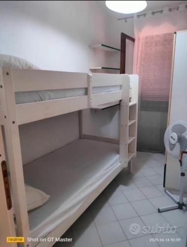 a bunk bed in a small room with at Villa Clelia in Stintino