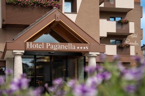 a hotel papayalia sign on a building with flowers at Hotel Paganella Andalo in Andalo