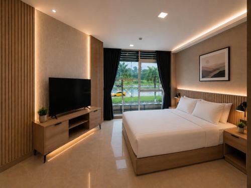a bedroom with a bed and a flat screen tv at Citto Inn Bangi in Bandar Baru Bangi
