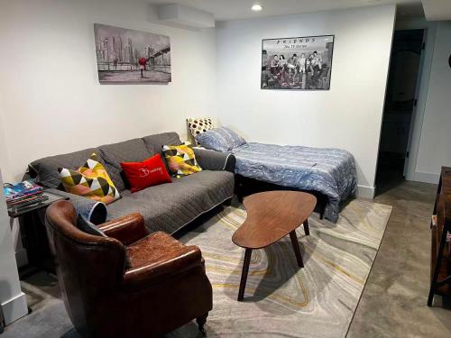 a living room with a couch and a table at Modern and warm house in Seattle