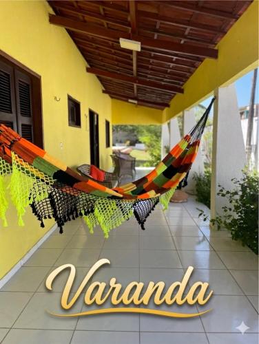 a hammock hanging from the side of a building at Paracuru Praia in Paracuru
