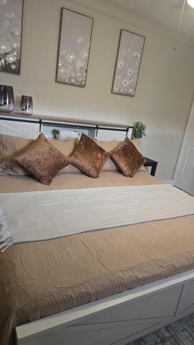 a large bed with pillows on it in a bedroom at Welcome to this romantic getaway in Sarasota