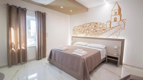 a bedroom with a bed with a clock on the wall at VIBINUM Bed & Breakfast in Bovino