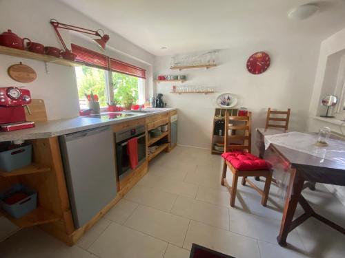 a kitchen with a counter and a table in it at Ferienwohnung Lindenstraße in Pirna